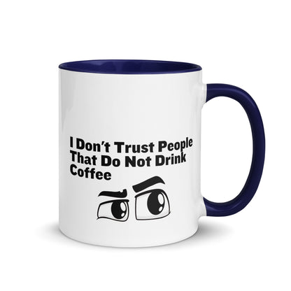 White ceramic mud with blue on the inside and on the handle with the words, "I don't trust people that do not drink coffee"