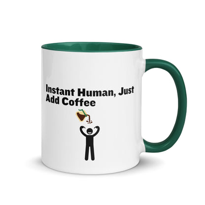 White ceramic mug with green inside and handle with the words "Instant human, just add coffee"