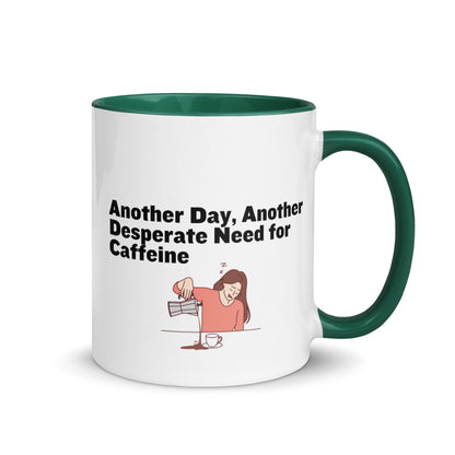 White ceramic coffee mug with green inside and handle with the words, "Anotehr day, another desperate need for caffeine" 