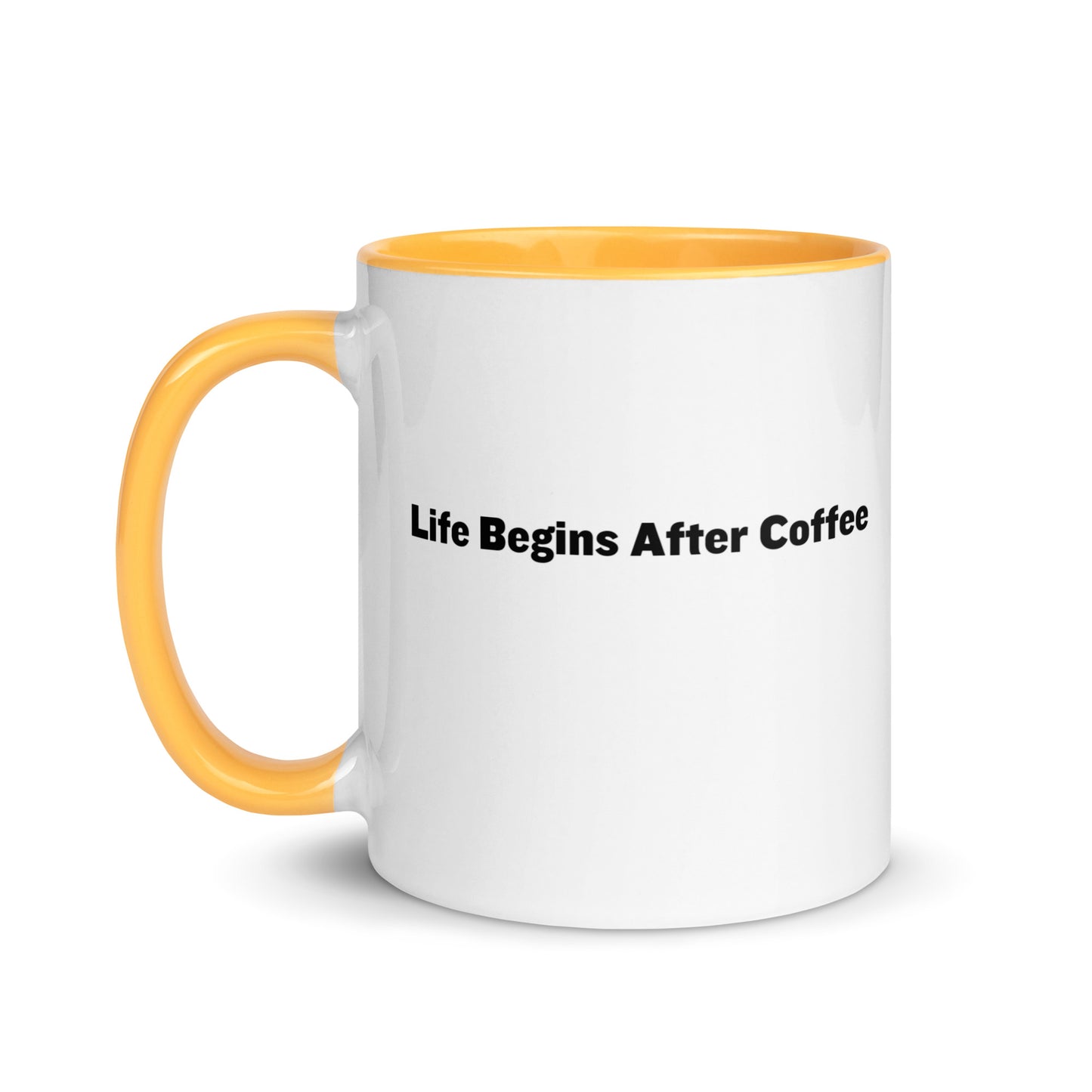 White ceramic mugs with golden yellow inside and handle with the words, "Life begins after coffee"