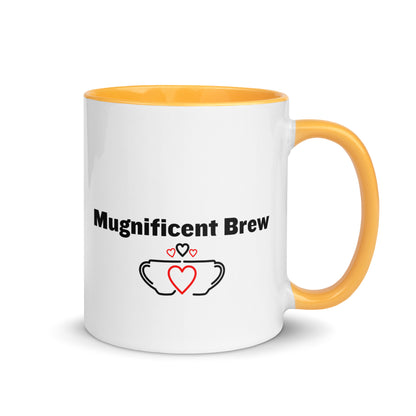 White ceramic mug with golden yellow inside and handle with the words, "Magnificent Brew"