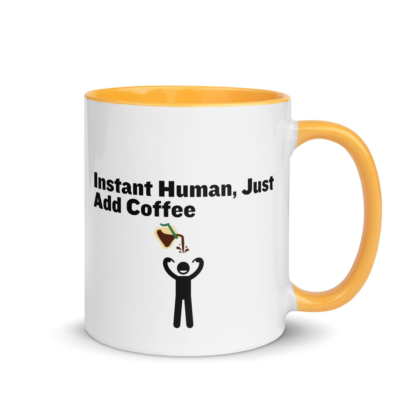 White ceramic mug with yellow inside and handle with the words "Instant human, just add coffee"