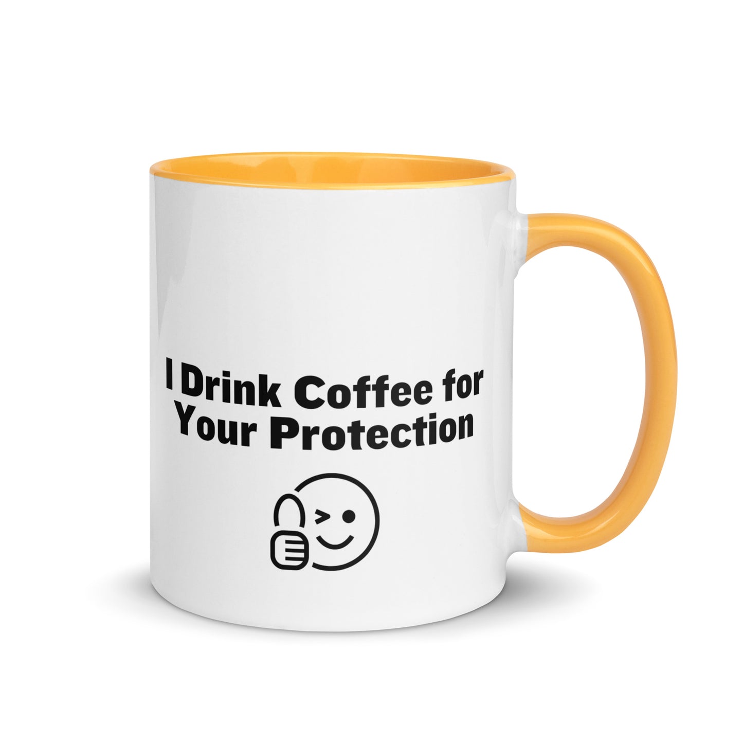 White ceramic mug that is golden yellow inside and on the handle with the words, "I drink coffee for your protection"