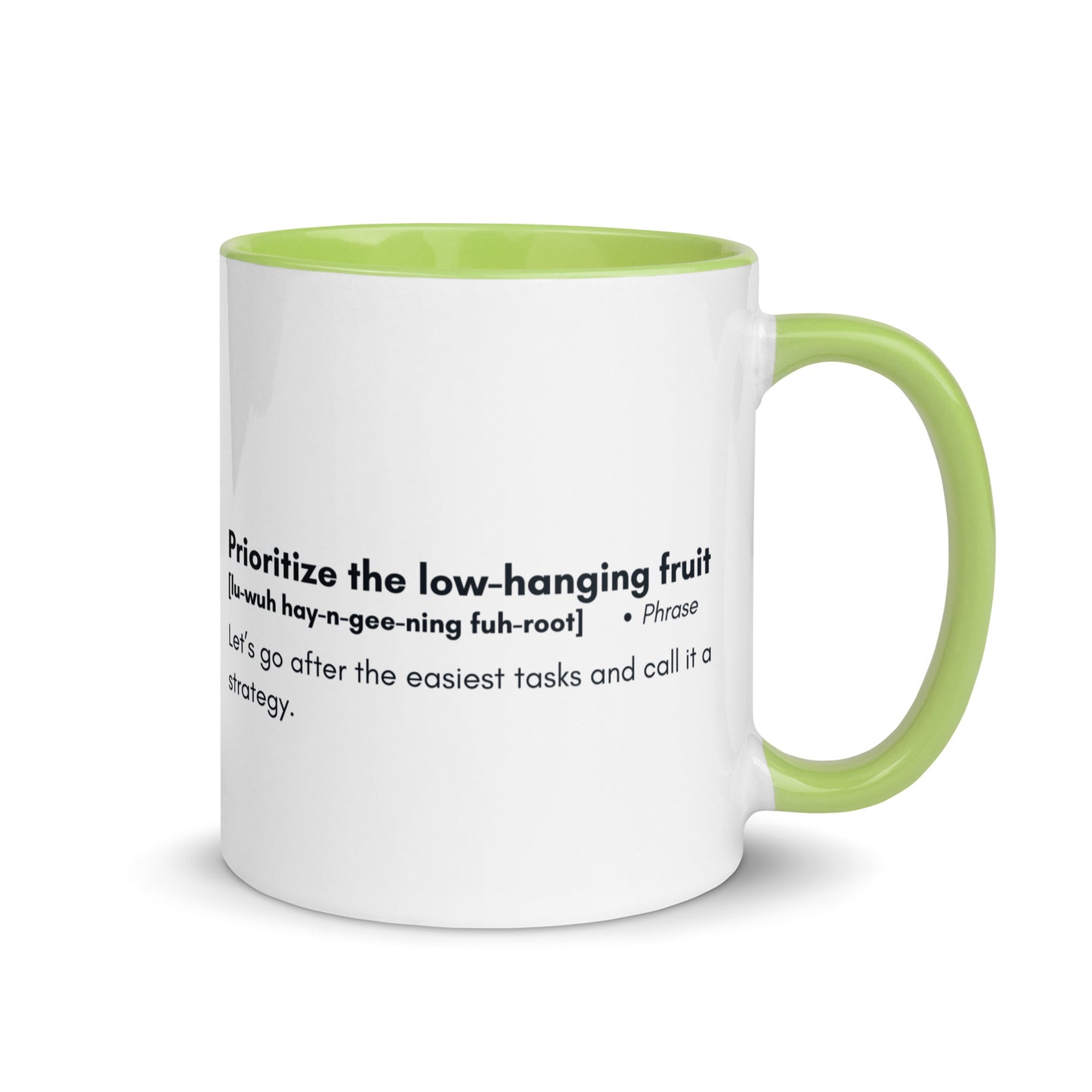 White ceramic mug with lime green inside and handle with words "Prioritize the low hanging fruit" followed by a humorous definition. 