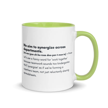 White ceramic mug with light green inside and handle with word,"We aim to synergize across departments" followed by a humorous definition.