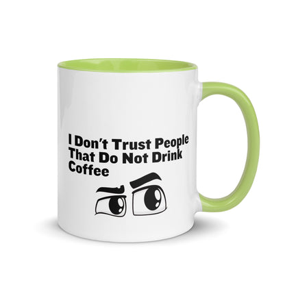 White ceramic mud with lime green on the inside and on the handle with the words, "I don't trust people that do not drink coffee"