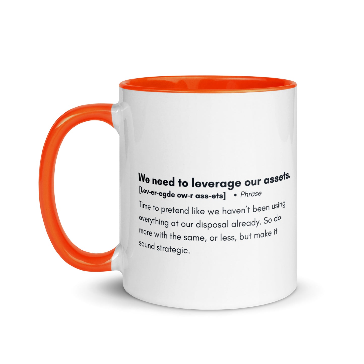 White ceramic mug with orange inside and handle with the words, "We need to leverage our assets" followed by a humorous definition.