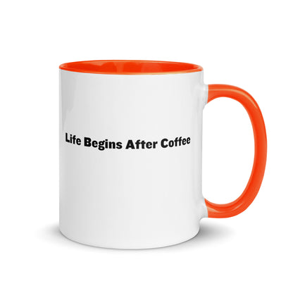 White ceramic mugs with orange inside and handle with the words, "Life begins after coffee"