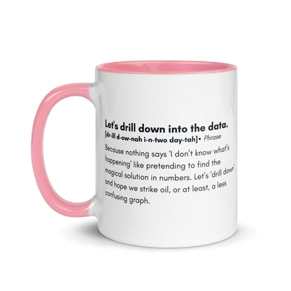 White ceramic mug with light pink inside and handle with the words, "Let's drill down into the data" followed by a humorous definition.