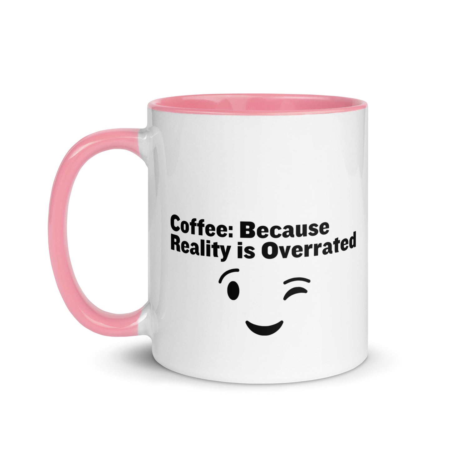 White ceramic mug with pink on the inside and on the handle with the words, "Coffee: Because reality is overrated"