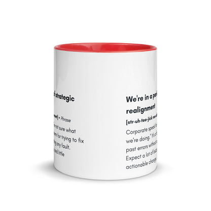 ceramic white mug with red inside and handle with the words "we're in a period of strategic realignment" with a humorous definition. 