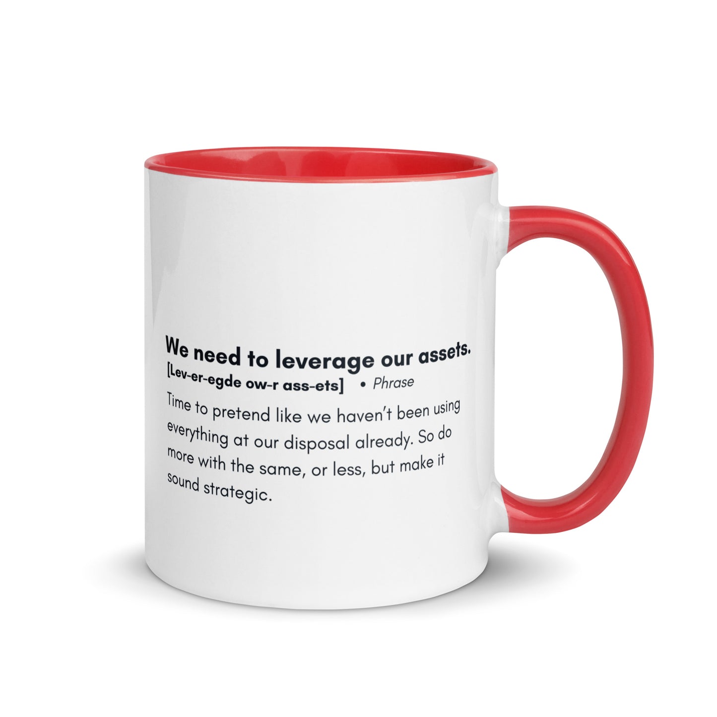 White ceramic mug with red inside and handle with the words, "We need to leverage our assets" followed by a humorous definition. 