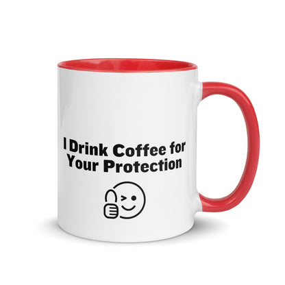 White ceramic mug that is red inside and on the handle with the words, "I drink coffee for your protection"