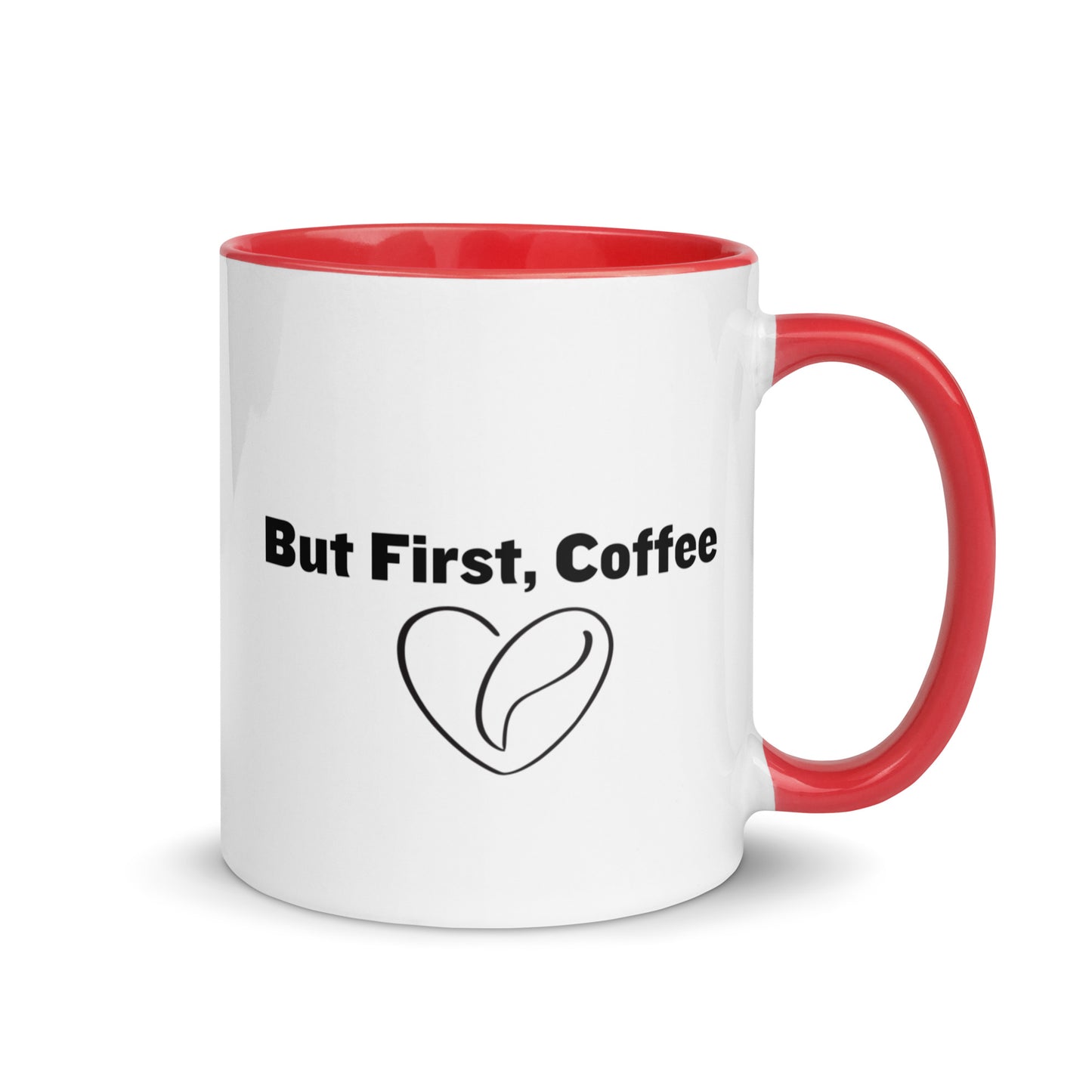 White ceramic mug with red on the inside and on the handle with words that say, "But first, coffee"