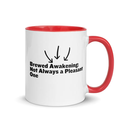 White ceramic mug with red on the inside and on the handle with the words, "Brewed awakening: Not always a pleasant one