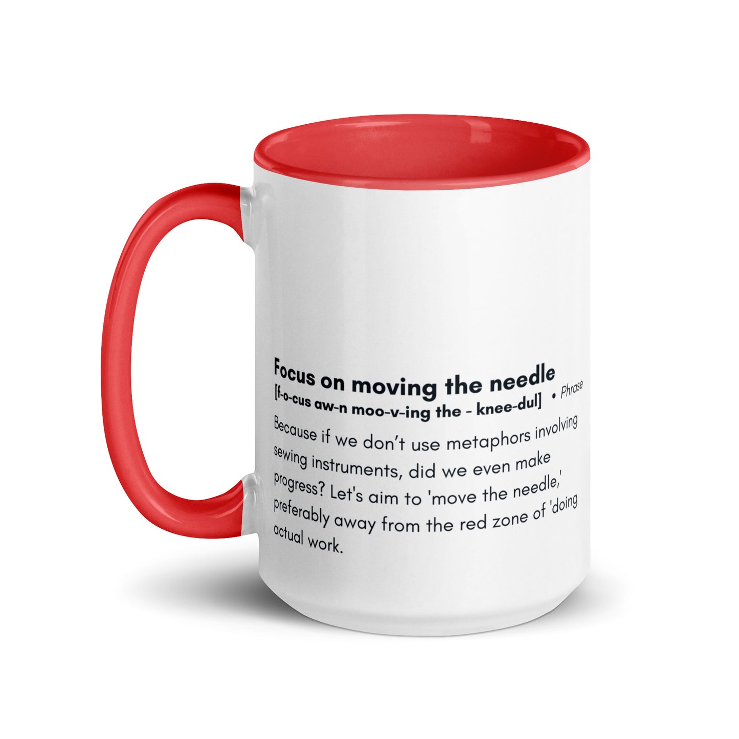 Ceramic white cup with red inside and handle with the words, "focus on moving the needle" followed by a humorous definition 