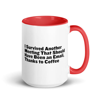 White ceramic mug with red inside and on the handle with words that say, "I survived another meeting that should have been an email, thanks to coffee"