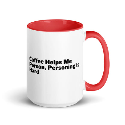 White ceramic mug with red inside and on the handle with the words, "Coffee helps me person, personing is hard"