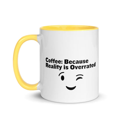 White ceramic mug with yellow on the inside and on the handle with the words, "Coffee: Because reality is overrated"