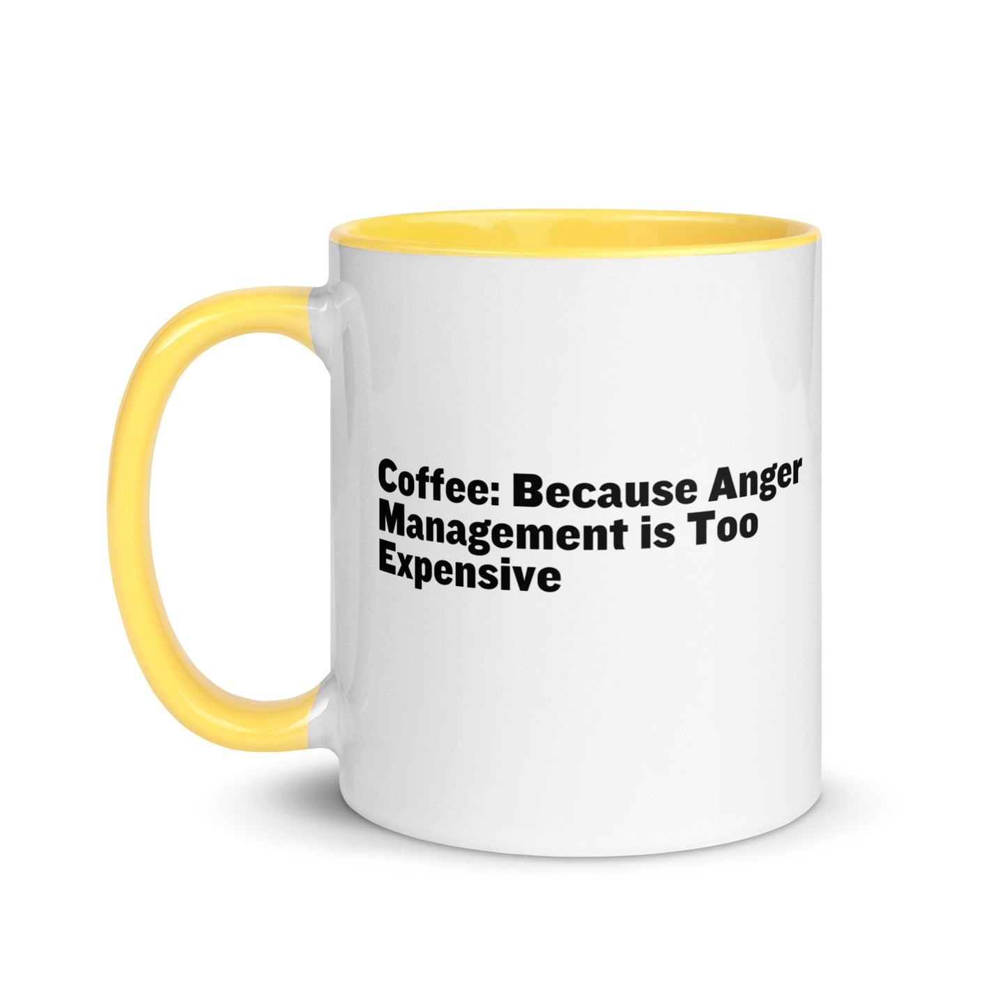 White ceramic mug with yellow inside and on the handle with the words, "Coffee: Because Anger management is too expensive"