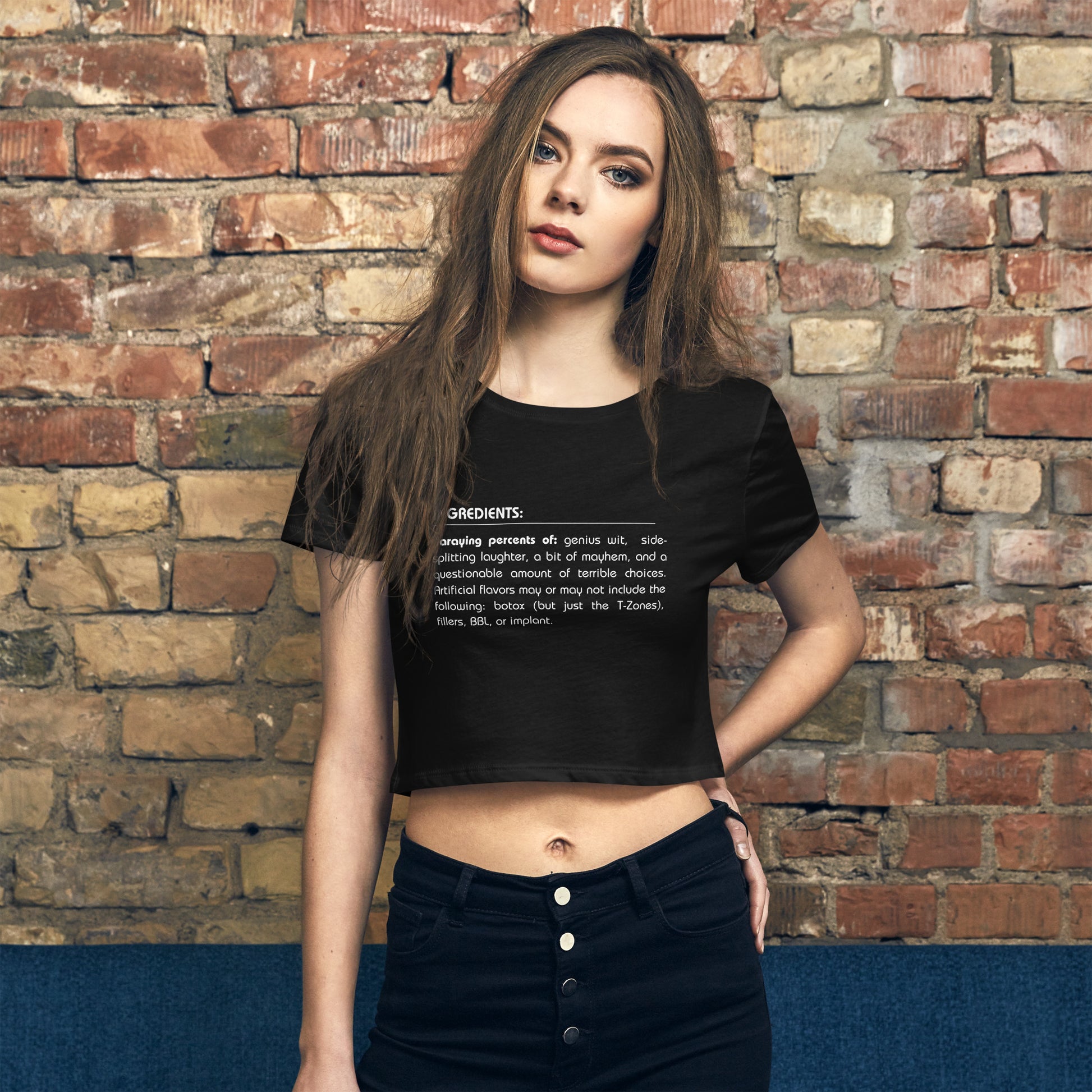 Woman wearing a black sarcastic graphic crop top with a witty ingredients list design.