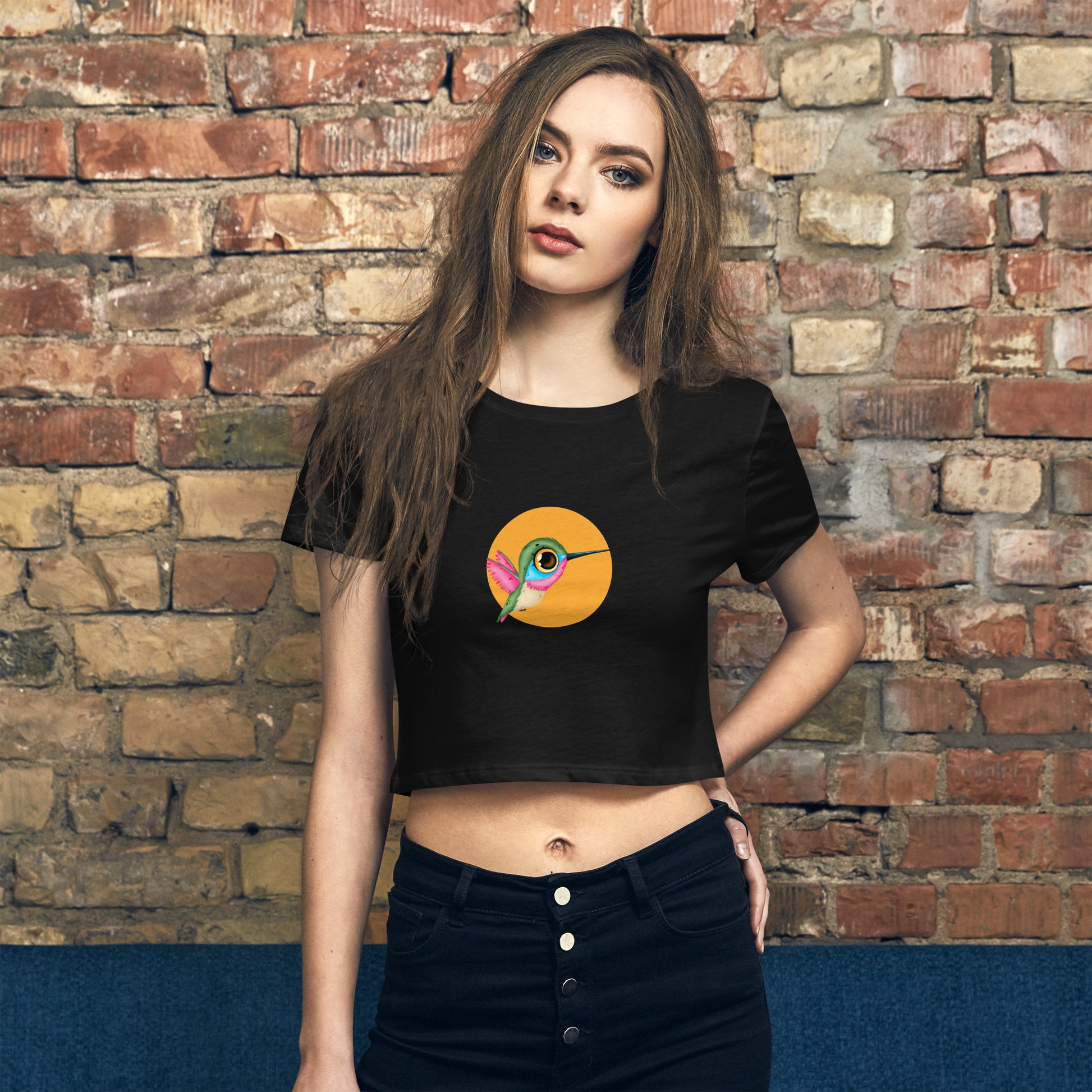 Trendsetter in an black quirky graphic crop top, making a bold statement of individuality and fun.