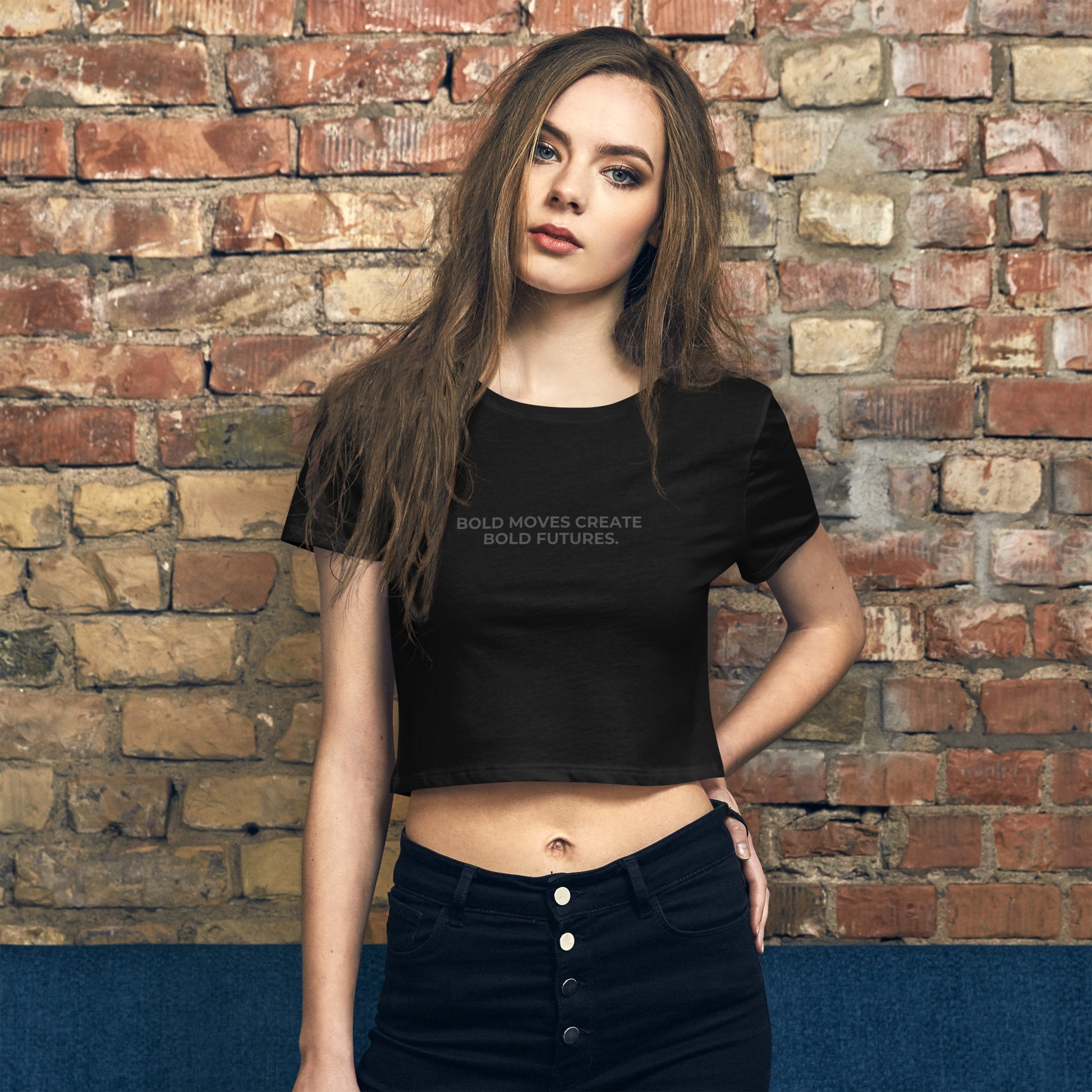 Bold slim-fit black crop top for women with "Bold Moves Create Bold Futures" quote. 