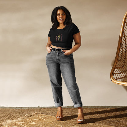 A woman wearing a black slim fit crop top with a modern tulip design.