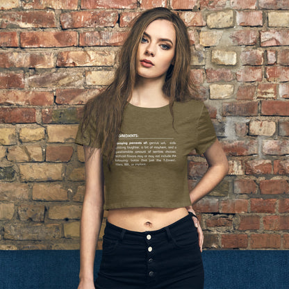 Woman wearing a heathered green sarcastic graphic crop top with a witty ingredients list design.