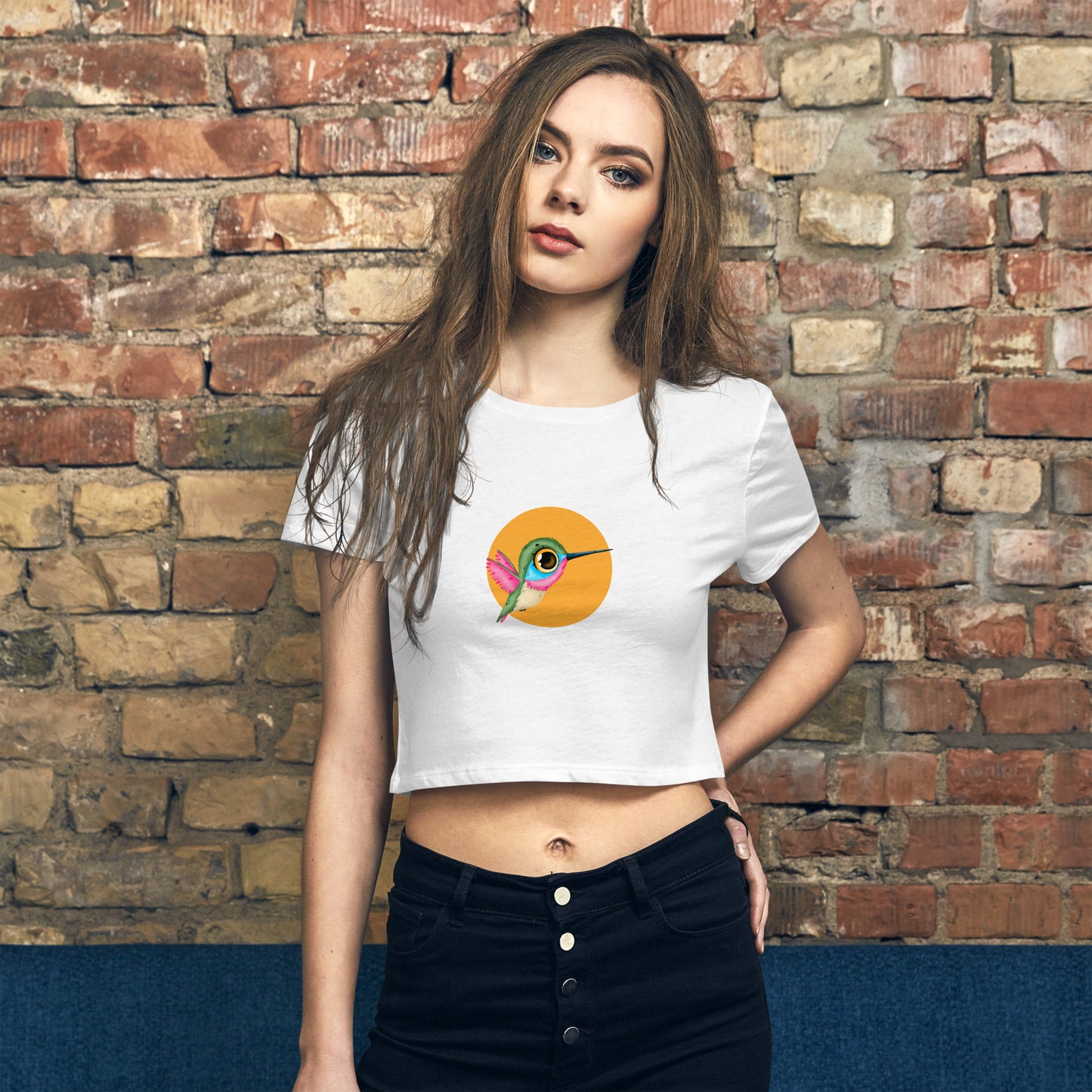 Trendsetter in an white quirky graphic crop top, making a bold statement of individuality and fun.