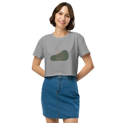 Woman wearing a athletic grey loose-fit crop top with a floral coffee cup graphic design, embodying comfortable and authentic fashion by BYOL.