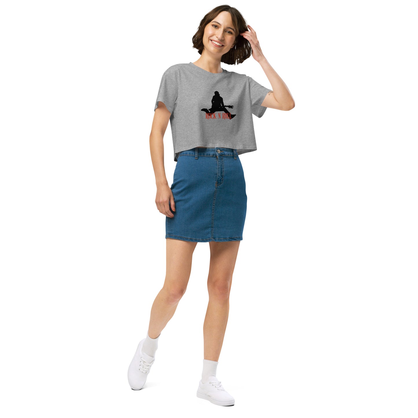 Woman in a grey loose-fit crop top with a Rock N’ Roll graphic