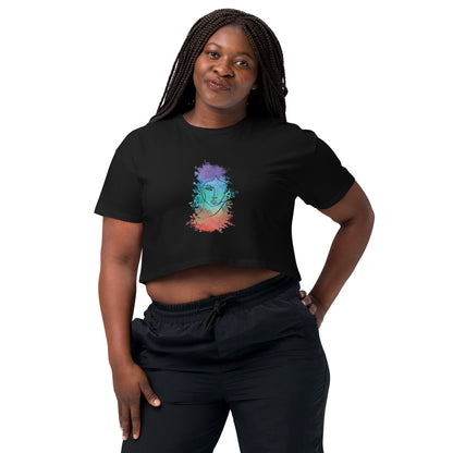 Woman in a black crop top with a colorful cosmic design expressing artistic individuality