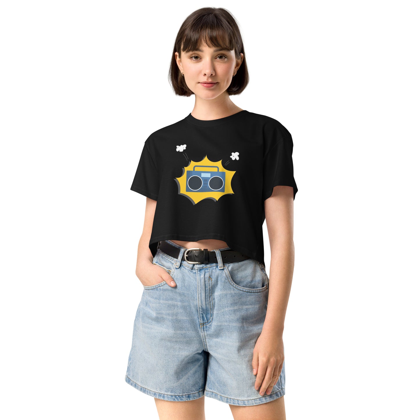 Woman in black crop top featuring a quirky camera graphic with playful accents