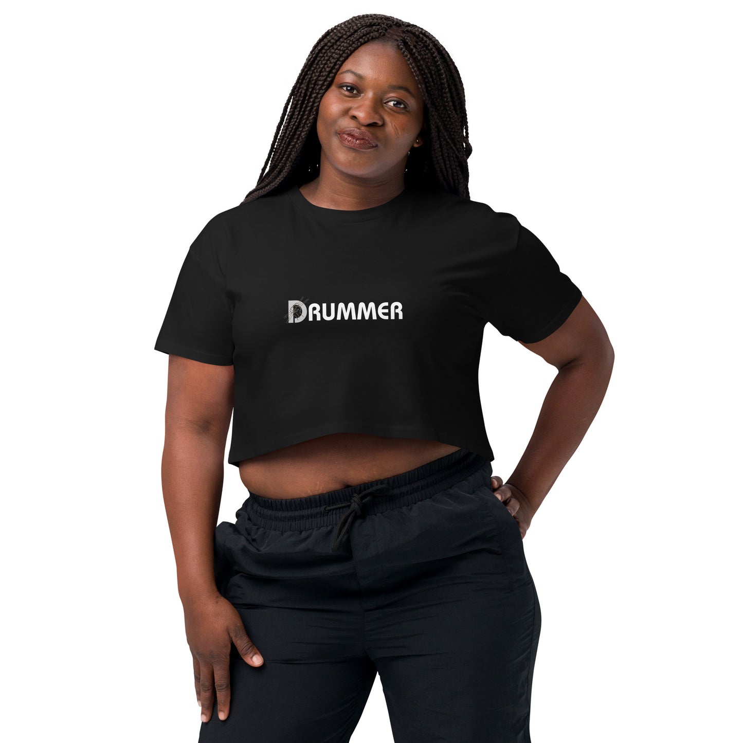 Confident woman in black 'DRUMMER' bold statement loose-fit crop top