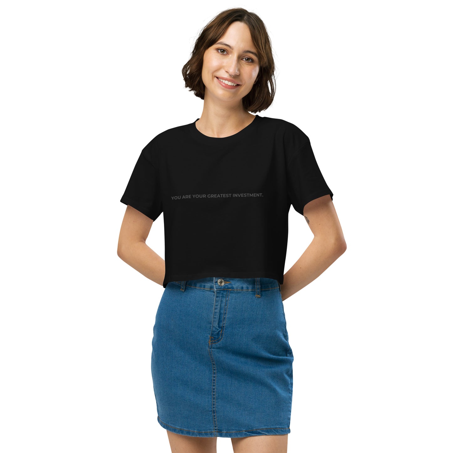 Women’s black Loose-Fit Crop Top with "You are your greatest investment" slogan in various colors and sizes, XS to XL.