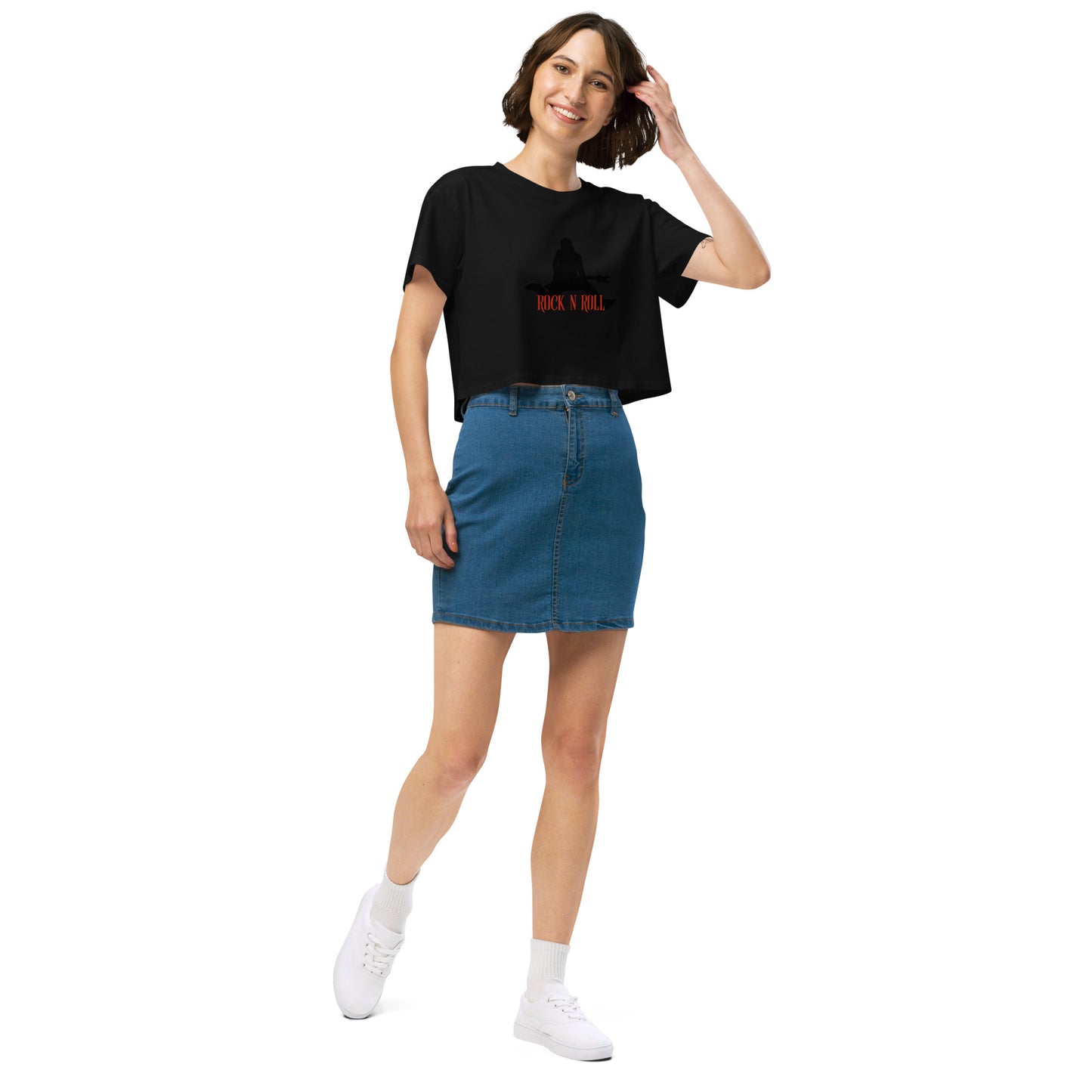 Woman in a black loose-fit crop top with a Rock N’ Roll graphic