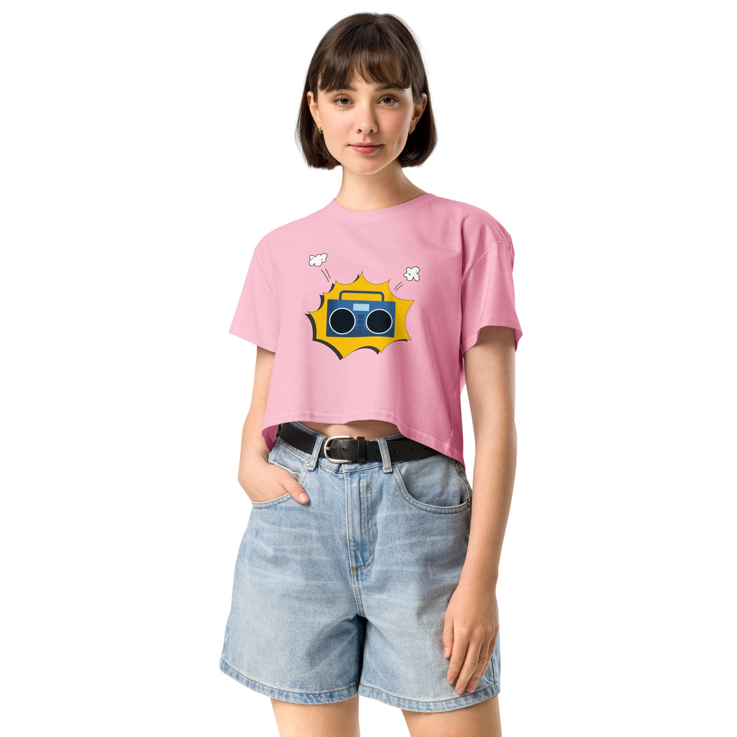 Woman in bubblegum pink crop top featuring a quirky camera graphic with playful accents