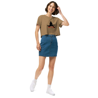 Woman in a camel loose-fit crop top with a Rock N’ Roll graphic