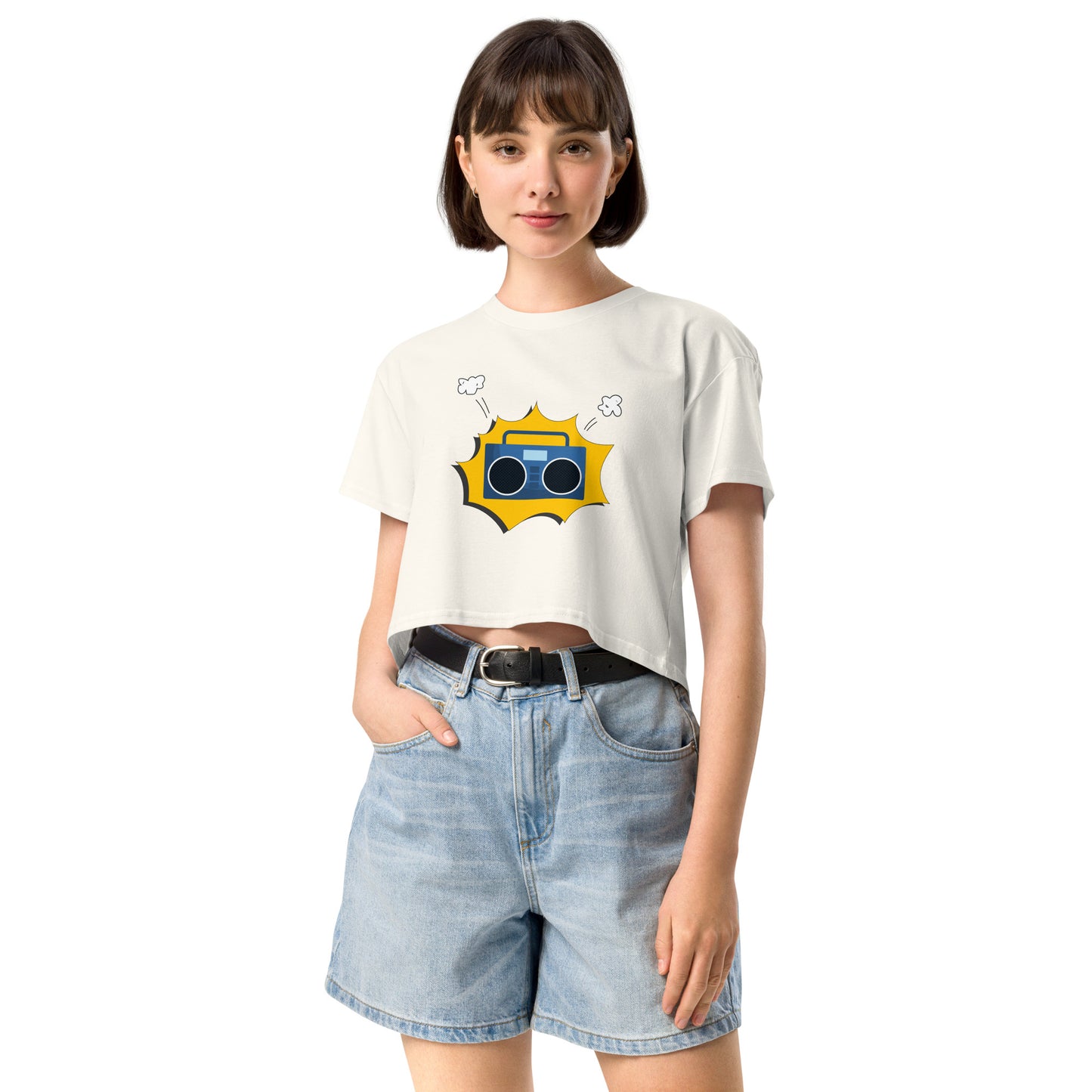 Woman in ecru crop top featuring a quirky camera graphic with playful accents