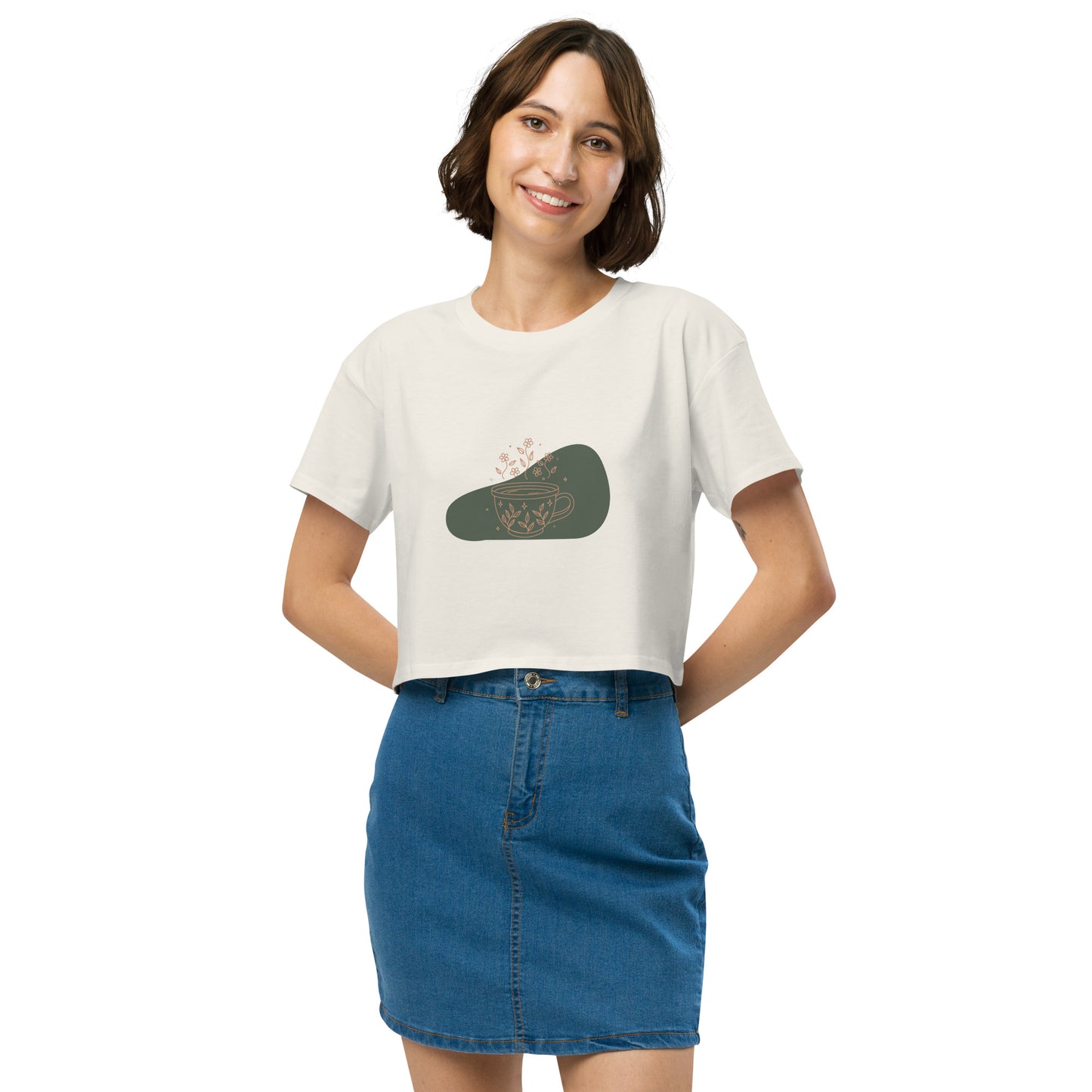 Woman wearing a ecru loose-fit crop top with a floral coffee cup graphic design, embodying comfortable and authentic fashion by BYOL.