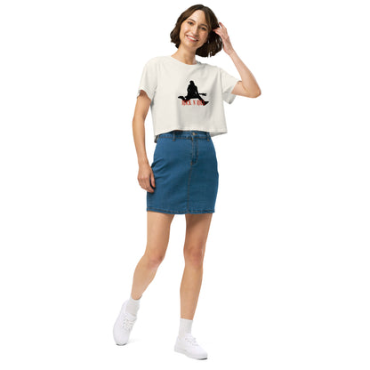 Woman in a ecru loose-fit crop top with a Rock N’ Roll graphic