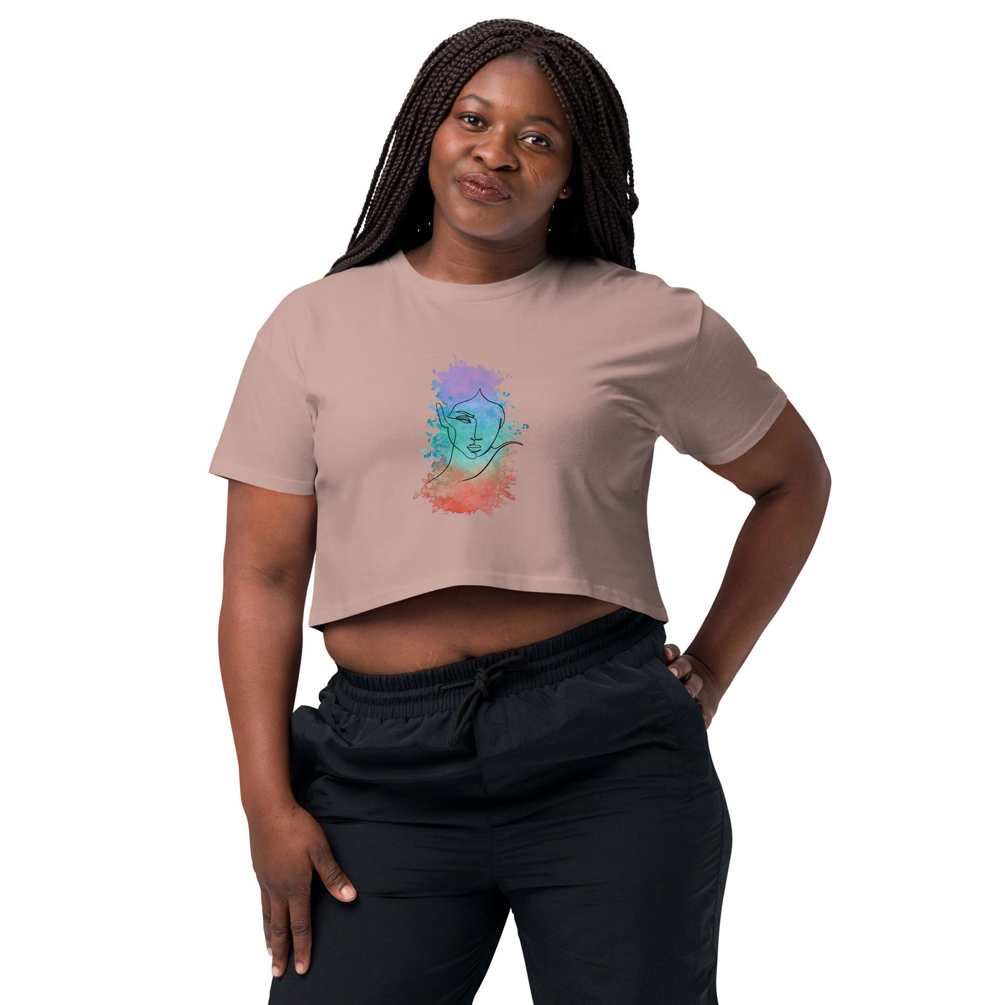 Woman in a hazy pink crop top with a colorful cosmic design expressing artistic individuality