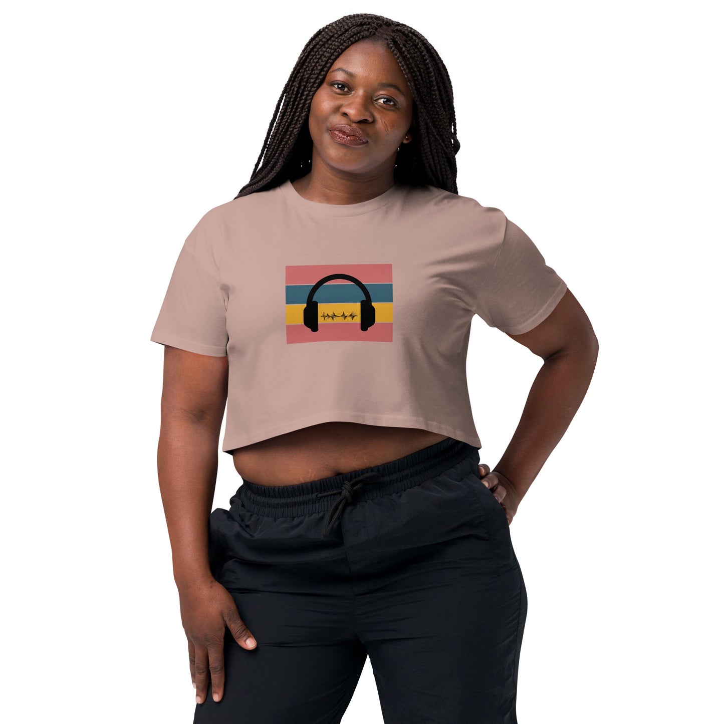 Confident woman wearing a hazy crop top with colorful headphone graphic design.