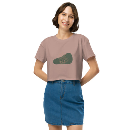 Woman wearing a hazy pink loose-fit crop top with a floral coffee cup graphic design, embodying comfortable and authentic fashion by BYOL.