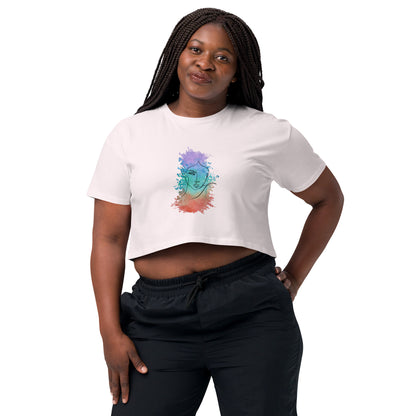 Woman in a orchid crop top with a colorful cosmic design expressing artistic individuality