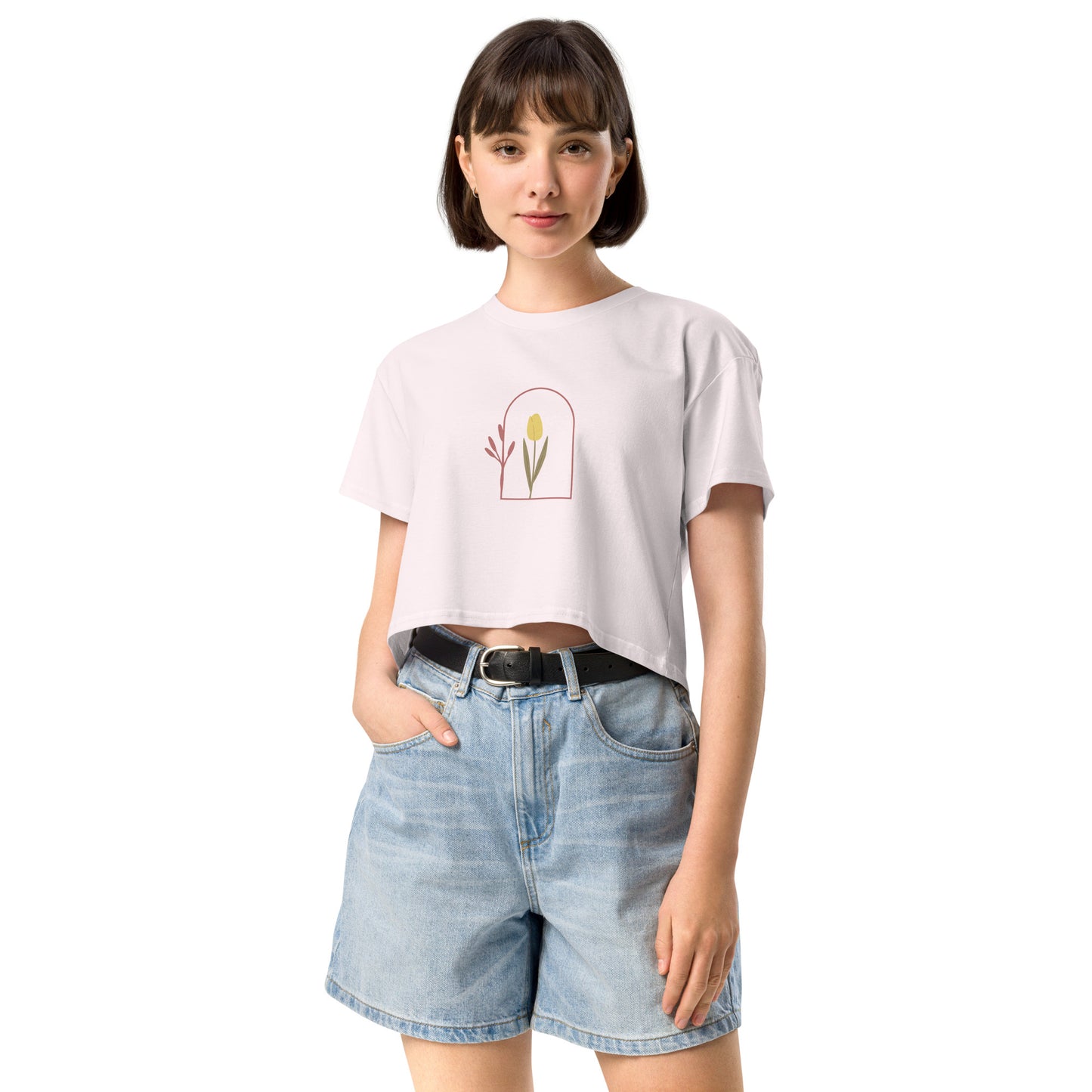 Woman wearing a orchid loose-fit crop top with a delicate floral window graphic design, representing comfortable and authentic fashion by BYOL.