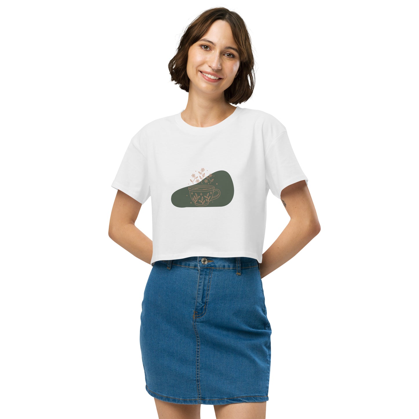 Woman wearing a white loose-fit crop top with a floral coffee cup graphic design, embodying comfortable and authentic fashion by BYOL.