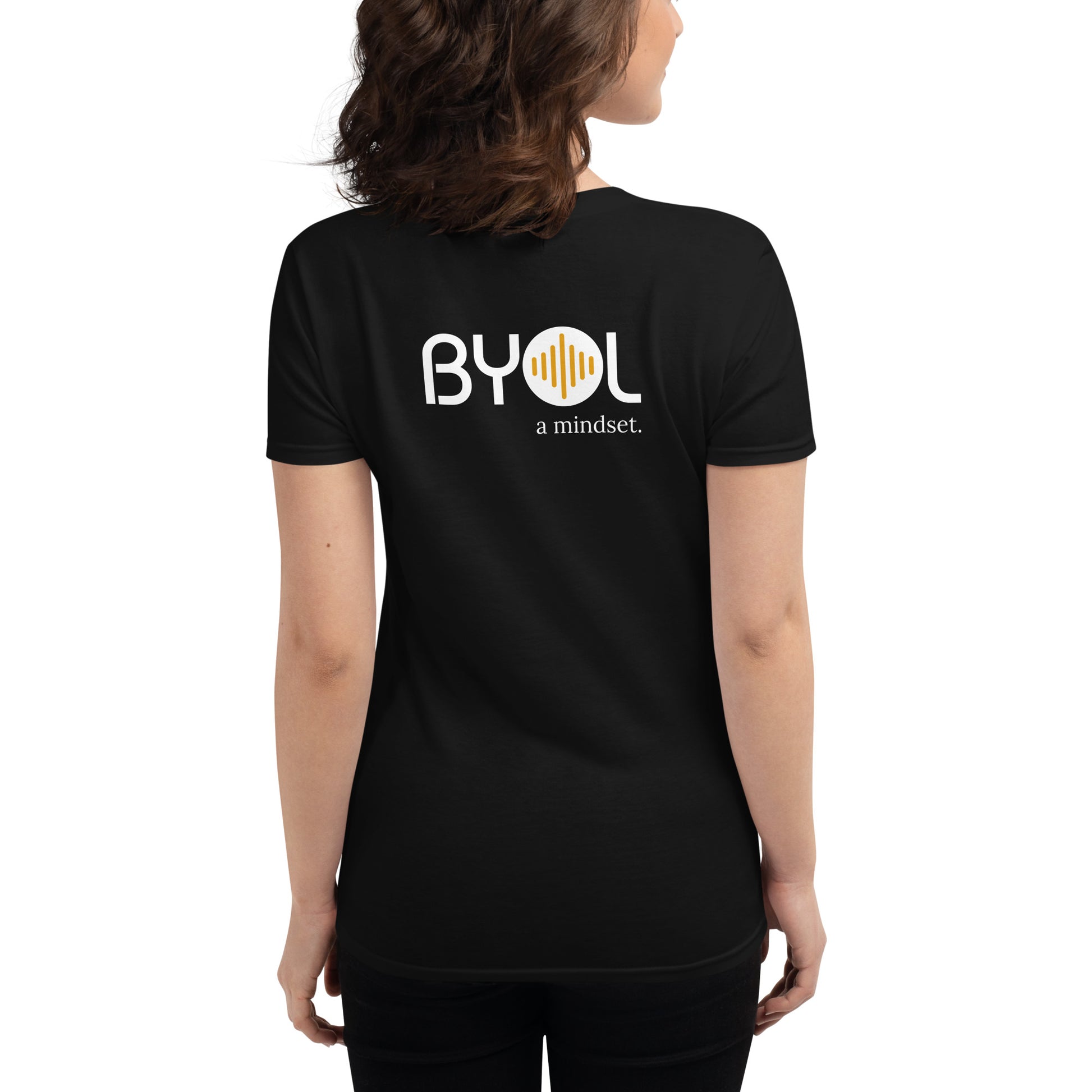 Back view of a woman wearing a black BYOL mindset t-shirt with color options in black, red, blue, gray, and white, available in sizes S to 3XL.