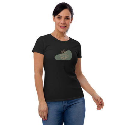 Woman wearing a black fitted tee with a floral mug design, highlighting a blend of comfort and subtle elegance by BYOL.